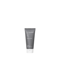 A tube of Perfect hair Day™ 5-in-1 Styling Treatment stands upright against a plain white background. The gray tube with white text smooths, protects, and styles hair for an effortless look.