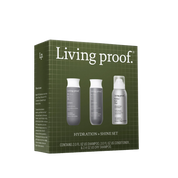A green box labeled Perfect hair Day™ Hydration + Shine Set displays shampoo, conditioner, and dry shampoo bottles on the front, with text below showing the included sizes in this hydration-focused haircare kit.