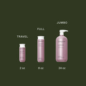 Three sizes of Restore Conditioner bottles are displayed on a dark green background: 2 oz (Travel), 8 oz (Full), and 24 oz with pump (Jumbo)—featuring Sili-CLONE HairTech to help reverse damage.
