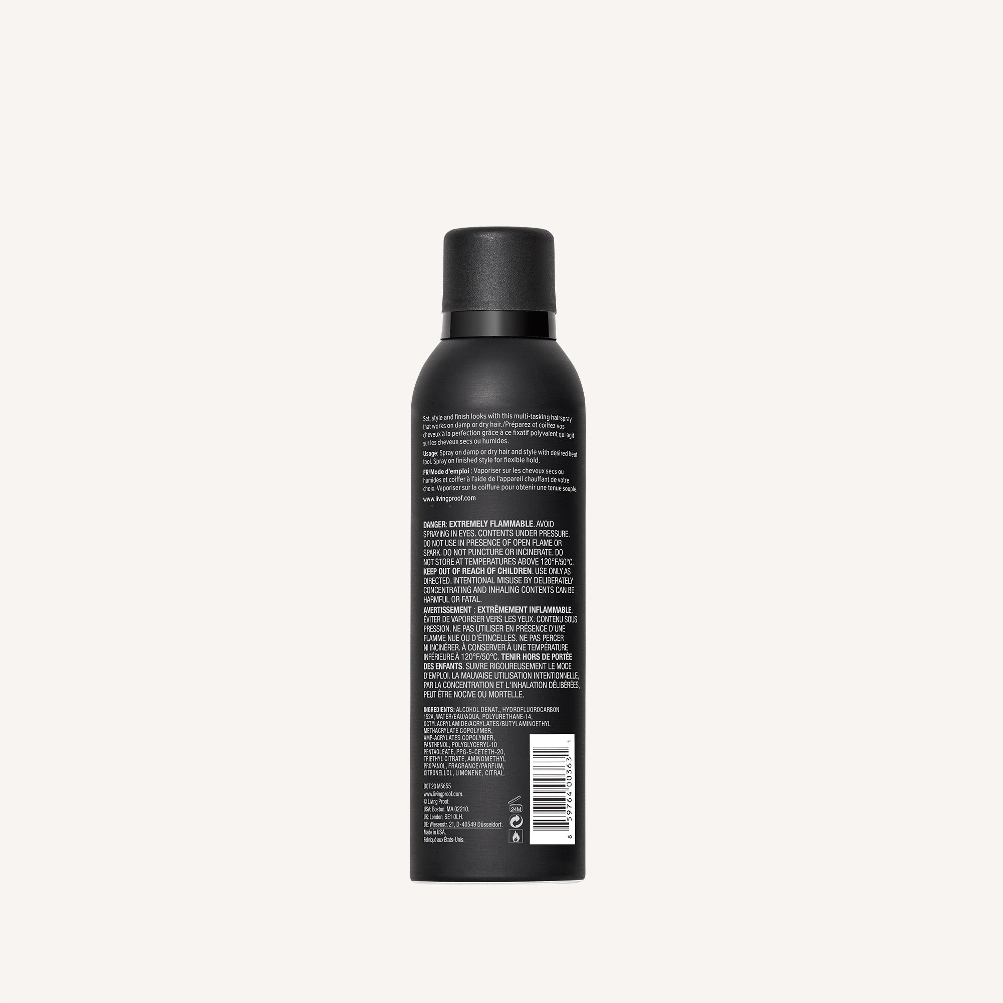 A black Style Lab® Flex Hairspray can with black cap, shown from the back with white text on the label, rests against a plain light background—ideal for touchable hair and medium hold to set your style.