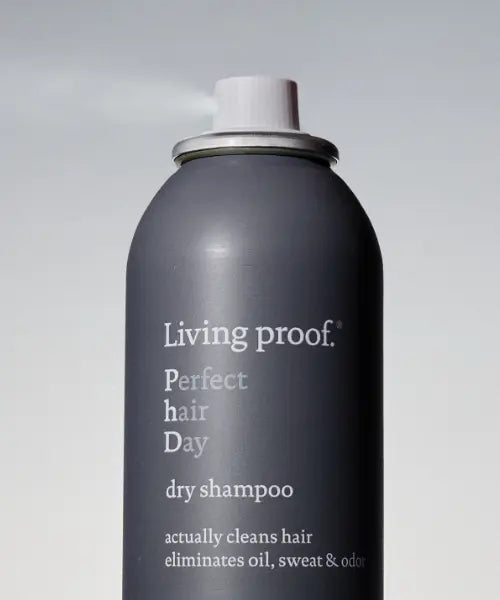 Living Proof Perfect hair Day dry shampoo can on a light gray background