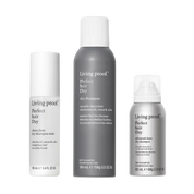 The Clean Hair Set includes three Living Proof hair care products: a sheer clean micellar dry shampoo mist (100 ml), a perfect hair day dry shampoo (184 ml), and an advanced clean dry shampoo (88 ml). Each bottle features a white and gray minimalist design, offering an easy way to achieve effortlessly clean hair.