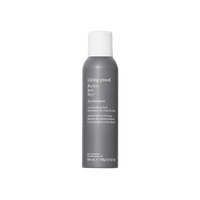 Living Proof dry shampoo bottle on a black background