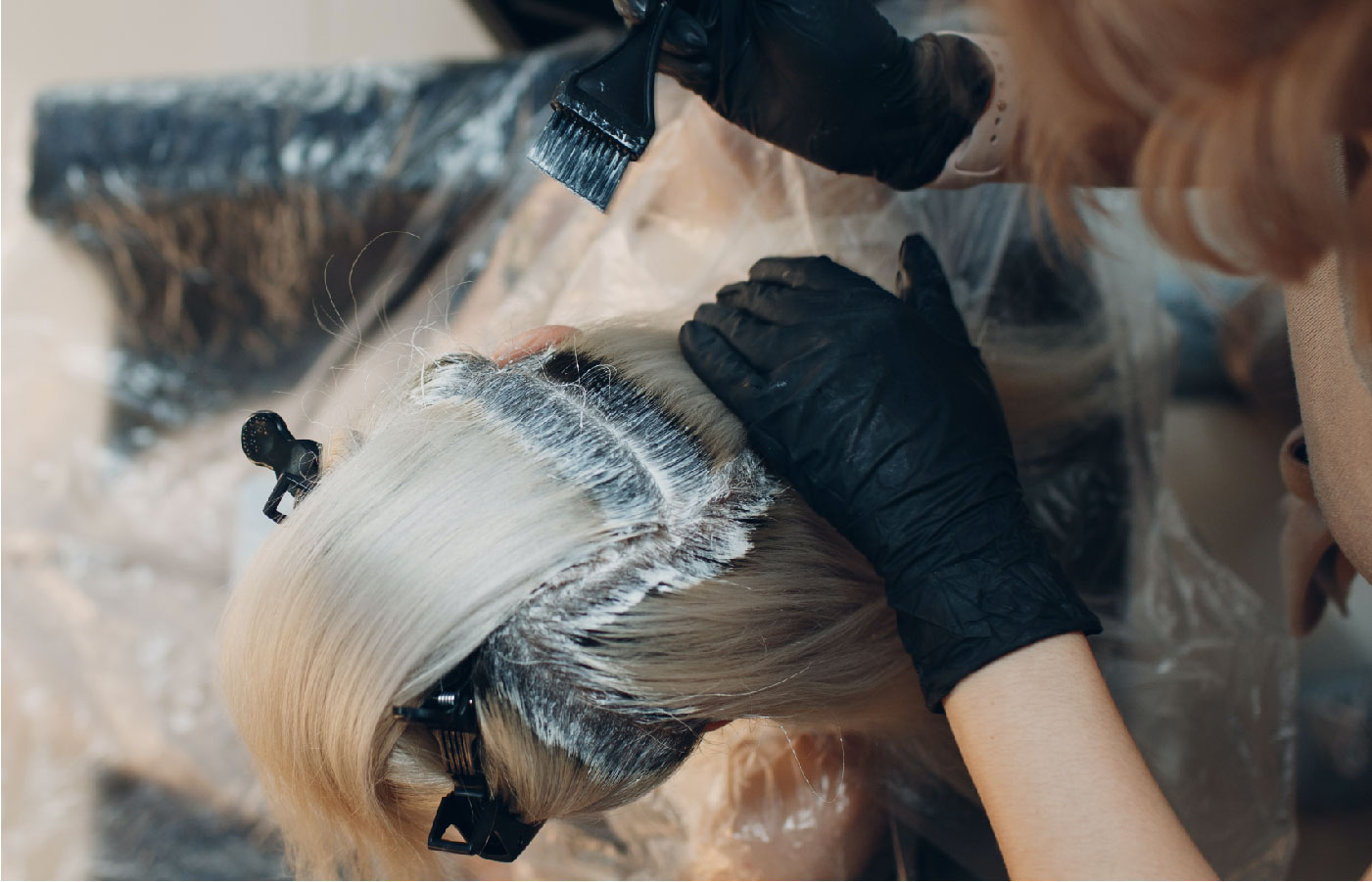 A person with hair bleach at a salon.