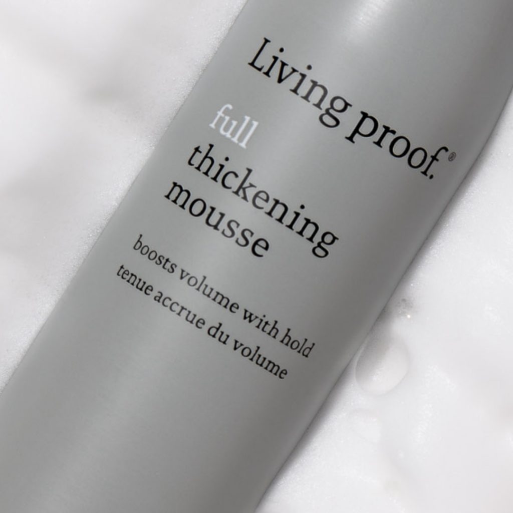 Close-up photograph of a bottle of Living Proof full thickening mousse hair product