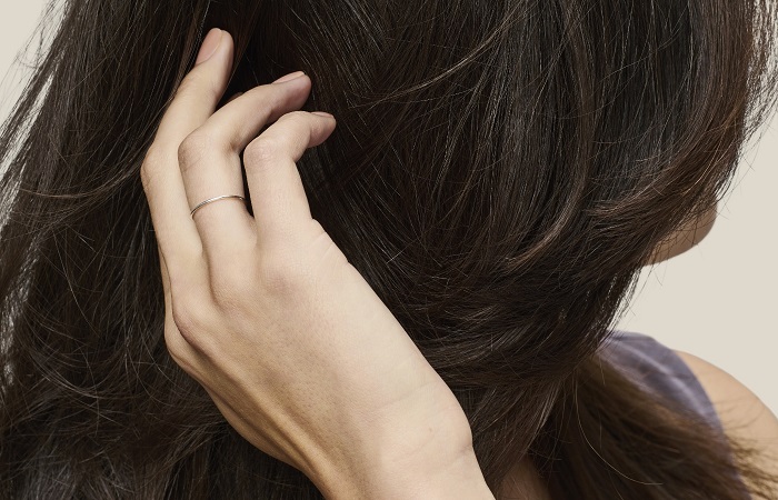 Woman touching her hair.